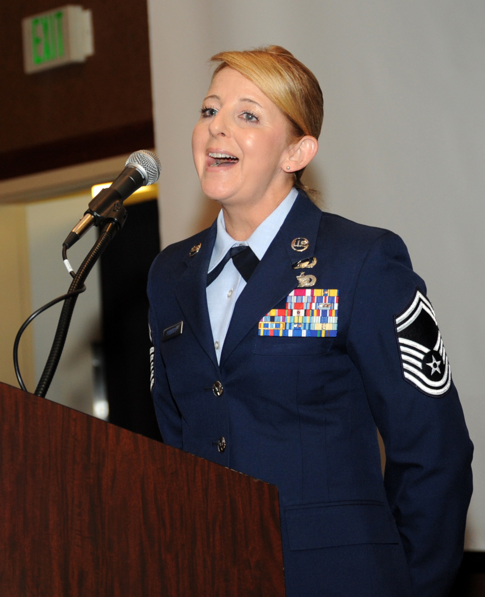 Oregon Air National Guard Senior Master Sgt. Denise Phillips, assigned to the 142nd Fighter Wing Mission Support Group, performs the National Anthem to begin the 21st Annual Oregon Air National Guard Awards Banquet, March 14, 2015, Portland, Ore. (U.S. Air National Guard photo by Tech. Sgt. Emily Thompson, 142nd Fighter Wing Public Affairs/Released)