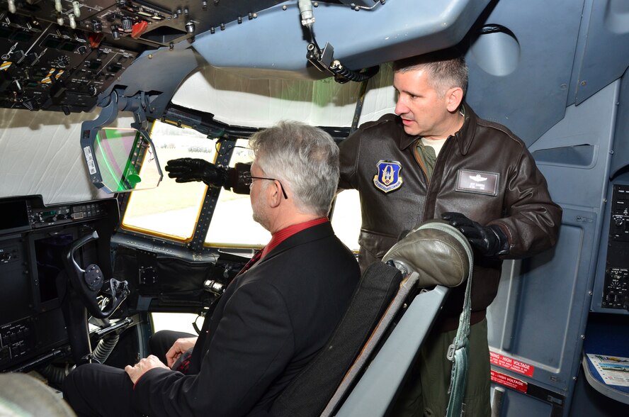 Lt. Col. Jeff Ragusa, a pilot with the 815th Airlift Squadron shows Mark Glorioso, a new 403rd Wing honorary commander,the control panels in the pilot's seat of a C-130J aircraft while taking a tour on Keesler Air Force Base. The 403rd Wing inducted 6 new honorary commanders March 6.