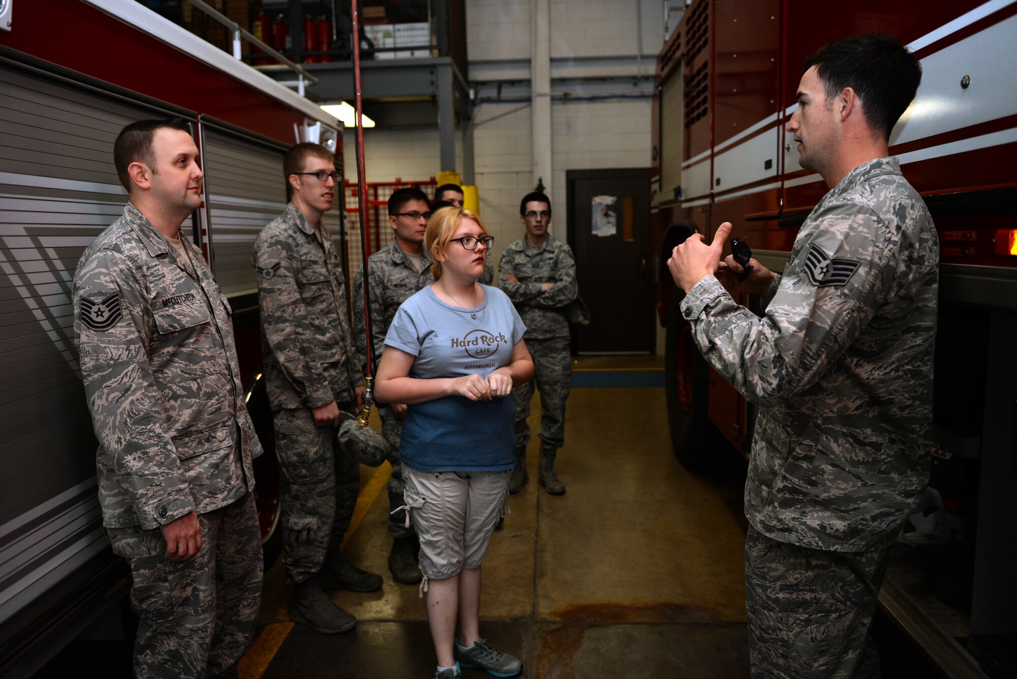 ALTUS AIR FORCE BASE, Okla. – U.S. Air Force Staff Sgt. Gregory Verbiski, 97th Civil Engineer Squadron fire protection journeyman, explains the fire station to visitors as part of the career fair, March 17, 2015. The group saw the living quarters of the firefighters and explored the fire trucks. (U.S. Air Force photo by Airman 1st Class Megan E. Acs/Released)