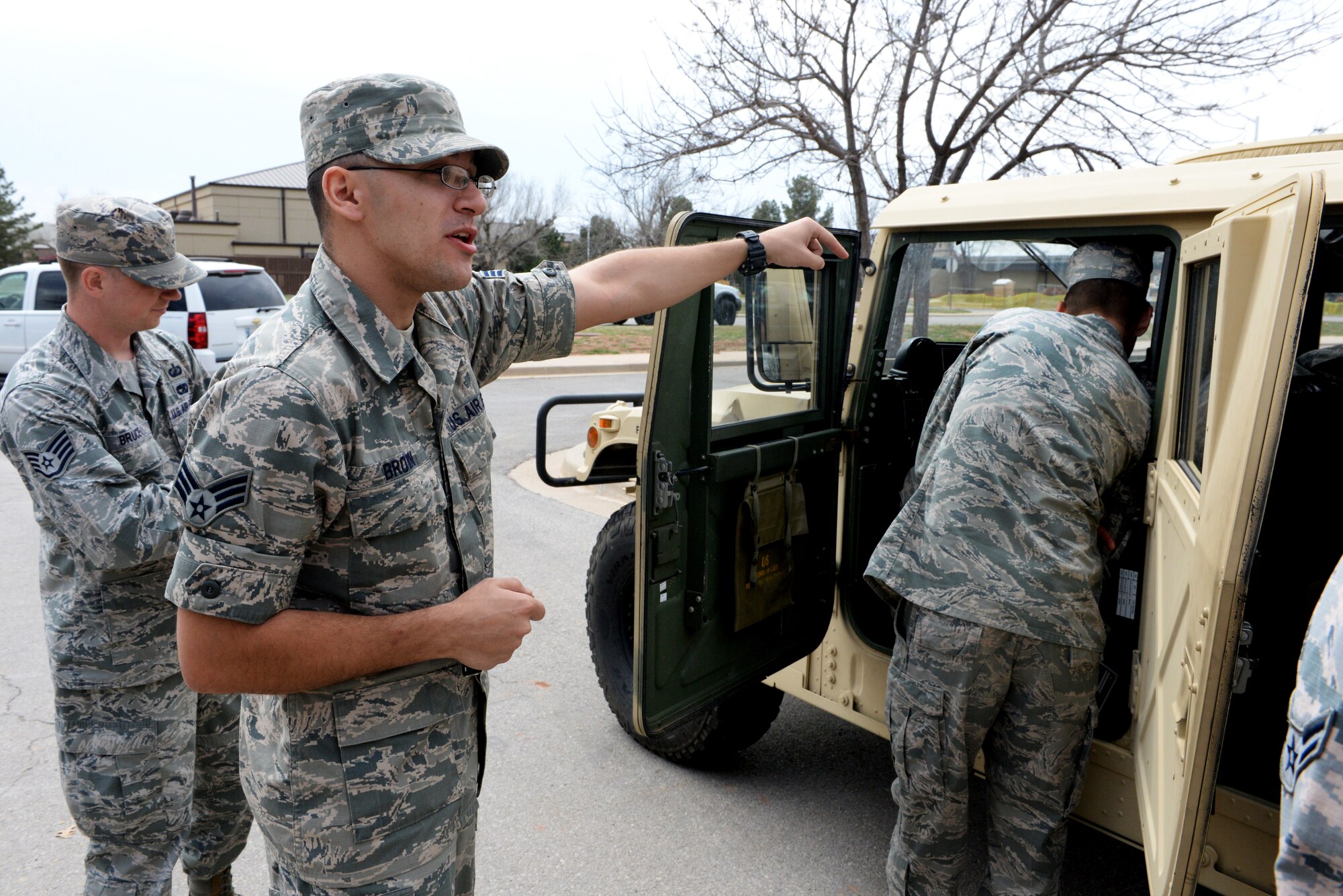 ALTUS AIR FORCE BASE, Okla. – U.S. Air Force Senior Airman Mitchel Brown, 97th Logistics Readiness Squadron vehicle operator, explains the functions of a Humvee during the career fair at the Freedom Community Center, March 17, 2015. Vehicle operations is tasked with transporting people and cargo and maintains a presence at every base with a flying mission. (U.S. Air Force Airman 1st Class Megan E. Acs/Released)