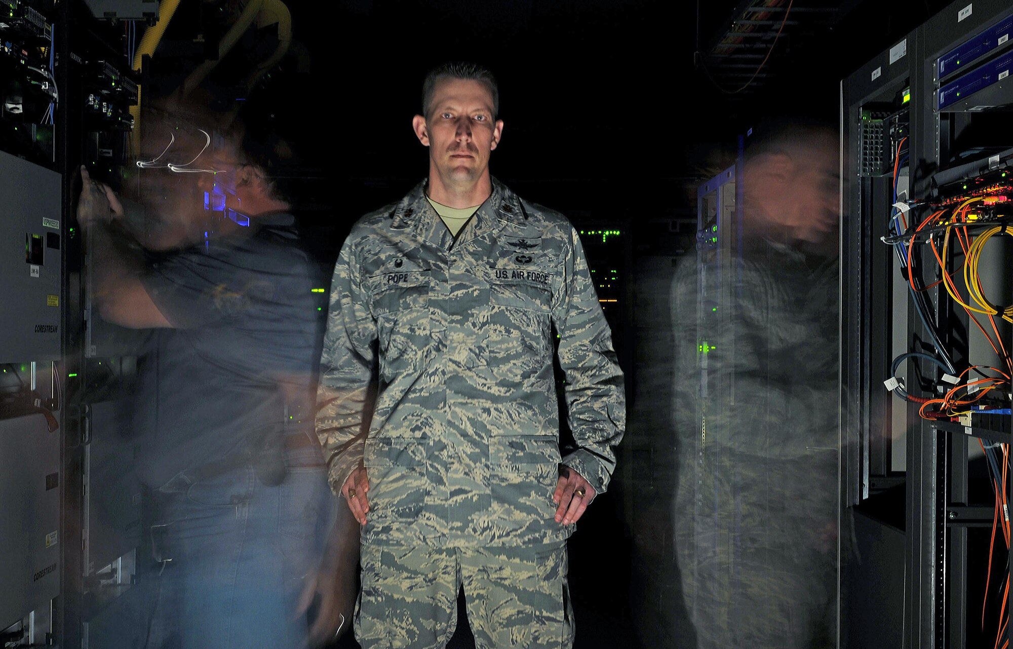 (01)	Maj. Billy Pope Jr., 81st Communications Squadron commander, poses for a photo in the base’s server room March 9, 2015, Keesler Air Force Base, Miss. Pope took command of the 81st CS in June 2014.This is his first assignment as a commander. (U.S. Air Force photo by Airman 1st Class Duncan McElroy)