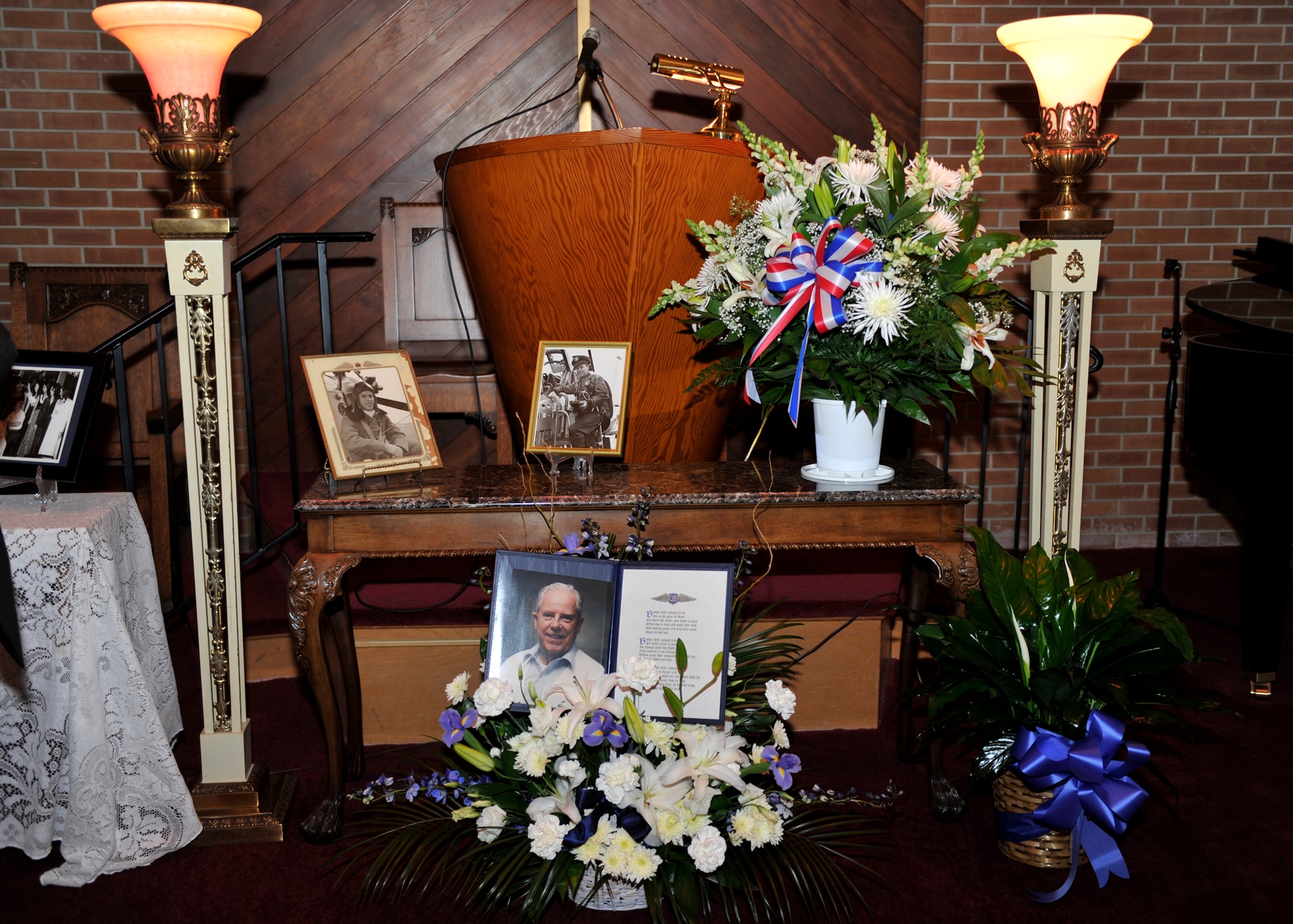 Photos of U.S. Air Force Col. (Ret.) Robert “Don” Gregor are displayed at the Wilson Funeral Home Chapel in Panama City, Fla. March 1 for his funeral. Gregor was the Tyndall base commander and the vice commander of the Weapons Center at one point in his career.  (U.S. Air Force photo by Airman 1st Class Sergio A. Gamboa/Released)