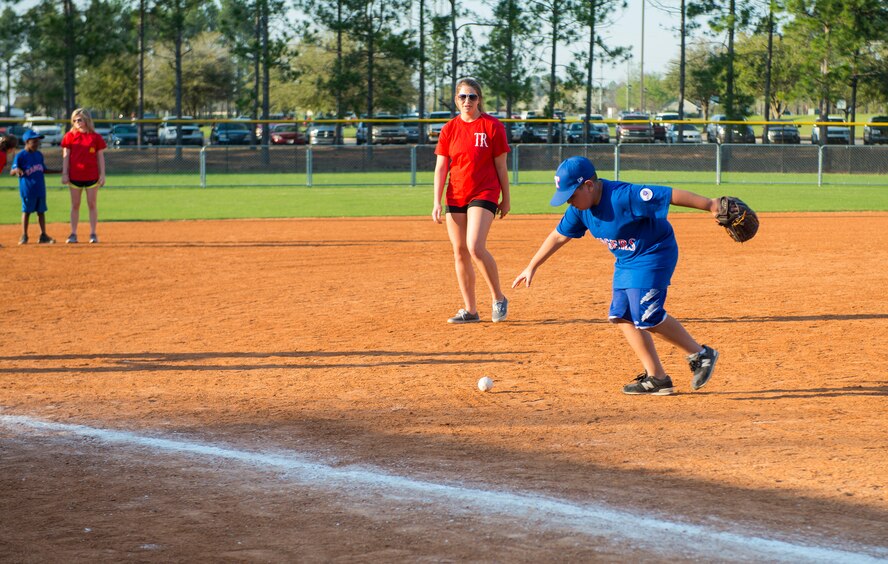 Justin Castillo, son of U.S. Air Force Tech. Sgt. Adrian Castillo, 23d Maintenance Operations Flight, runs for the ball during the Miracle League of Valdosta’s baseball game March 17, 2015, in Valdosta, Ga. The six-week league hosts games every Tuesday leading up to a final awards and medals ceremony. (U.S. Air Force photo by Airman 1st Class Ceaira Tinsley/Released)