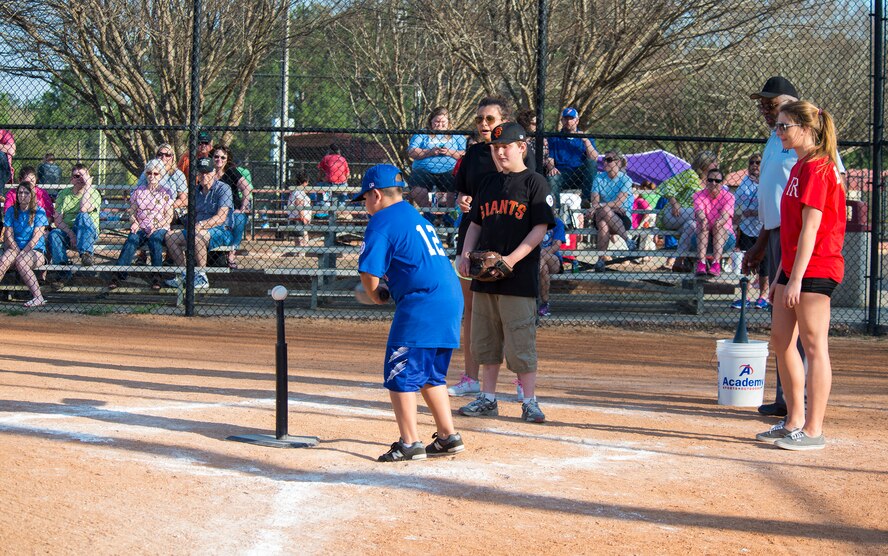 Justin Castillo, son of U.S. Air Force Tech. Sgt. Adrian Castillo, 23d Maintenance Operations Flight, swings at the ball during the Miracle League of Valdosta’s baseball game March 17, 2015, in Valdosta, Ga. The league provides an opportunity for disabled children and adults to play organized baseball. (U.S. Air Force photo by Airman 1st Class Ceaira Tinsley/Released)