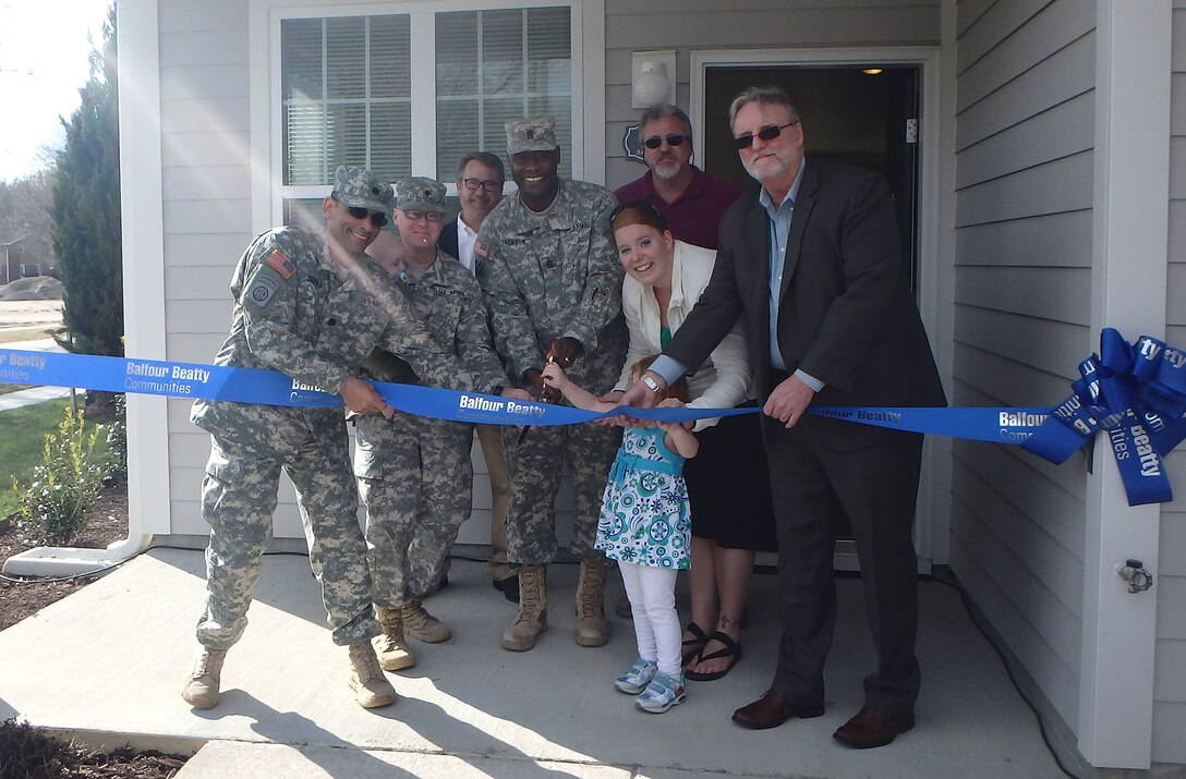 Fort Eustis leaders along with Balfour Beatty Communities project leaders perform a ribbon-cutting ceremony at Marseilles Village at Fort Eustis, Va., Mar. 17, 2015. The new $21 million community is available for senior noncommissioned officers and their families. It was the first project in the U.S. Army to receive an award for land certification due to efforts made in effective land use, recycling and environmental conservation efforts. 