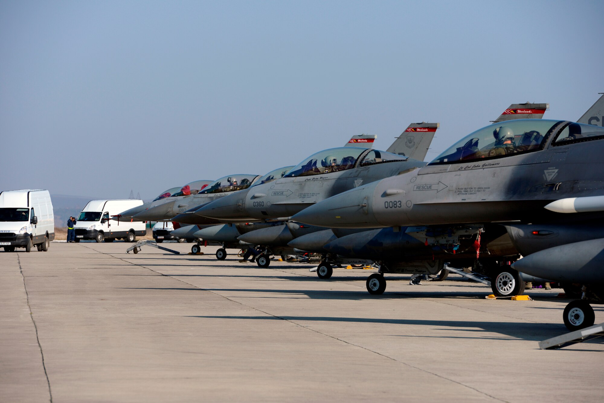 F-16CJ Fighting Falcons from the 480th Fighter Squadron are lined up on the flightline at Campia Turzii, Romania, for the first sortie of Dacian Warhawk, A two-week training mission designed to increase the interoperability between the U.S. and Romania, March 16, 2015. The training mission incorporated both ground and Air operations to help strengthen the bonds between NATO partners. (U.S. Air Force photo/Staff Sgt. Kris Levasseur)
