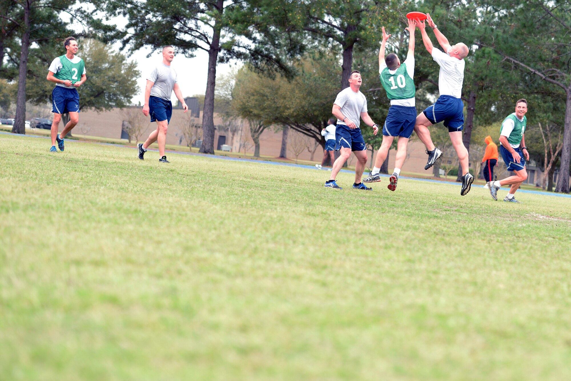 Members of the 93d Air Ground Operations Wing participate in a game of ultimate Frisbee during their Comprehensive Airmen Day March 13, 2015, at Moody Air Force Base, Ga. Members engaged in physical activity to promote the focus of the CAF Day which was the physical pillar. (U.S. Air Force photo by Airman Greg Nash/Released)