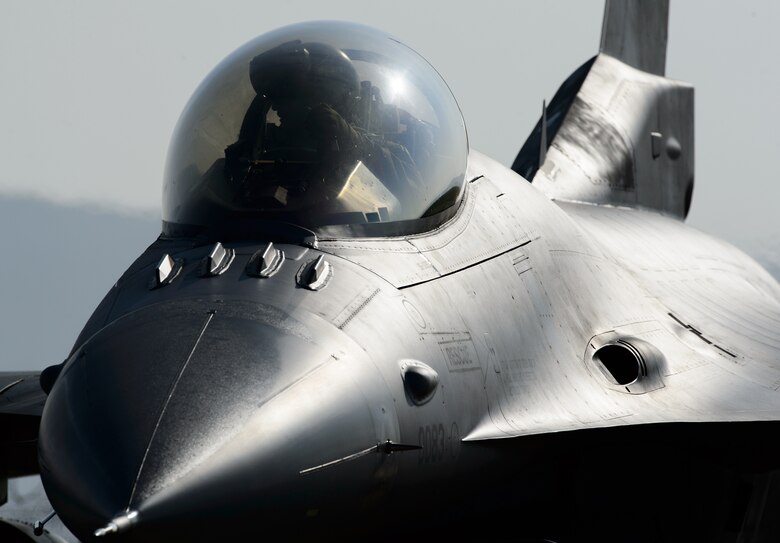 A 480th Fighter Squadron jet is readied for flight during the first gos of exercise Dacian Warhawk at Campia Turzii, Romania, March 16, 2015. The exercise provides an opportunity for both pilots and support Airmen to work together with their Romanian counterparts to strengthen relationships between nations. (U.S. Air Force photo/Staff Sgt. Armando A. Schwier-Morales)