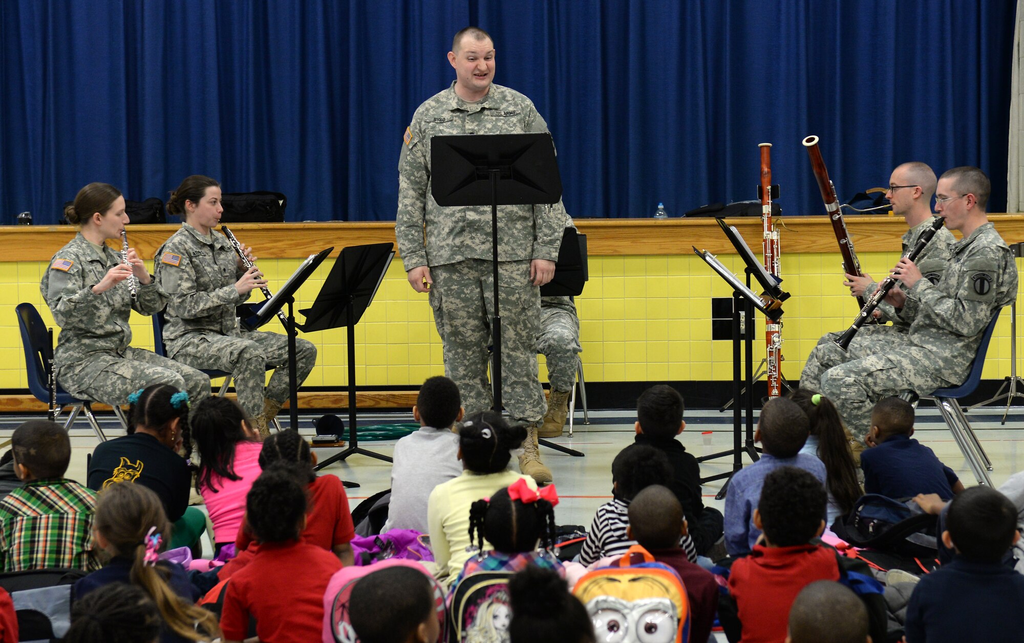 The U.S. Army Training and Doctrine Command Band Woodwind Quintet perform a sing-along song for kindergarten and first-grade students at George J. McIntosh Elementary School in Newport News, Va., March 16, 2015. During the month of March, TRADOC Band performance teams travel to schools in the local area ranging from elementary schools to high schools and some colleges to teach students about music and the Army . (U.S. Air Force photo by Staff Sgt. Teresa J. Cleveland/Released)