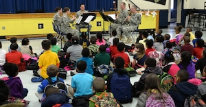 The U.S. Army Training and Doctrine Command Band Woodwind Quintet perform for kindergarten and first-grade students at George J. McIntosh Elementary School in Newport News, Va., March 16, 2015. Performance teams from the TRADOC band travel to Hampton Roads area schools to perform and teach children about the Army and music. (U.S. Air Force photo by Staff Sgt. Teresa J. Cleveland/Released)