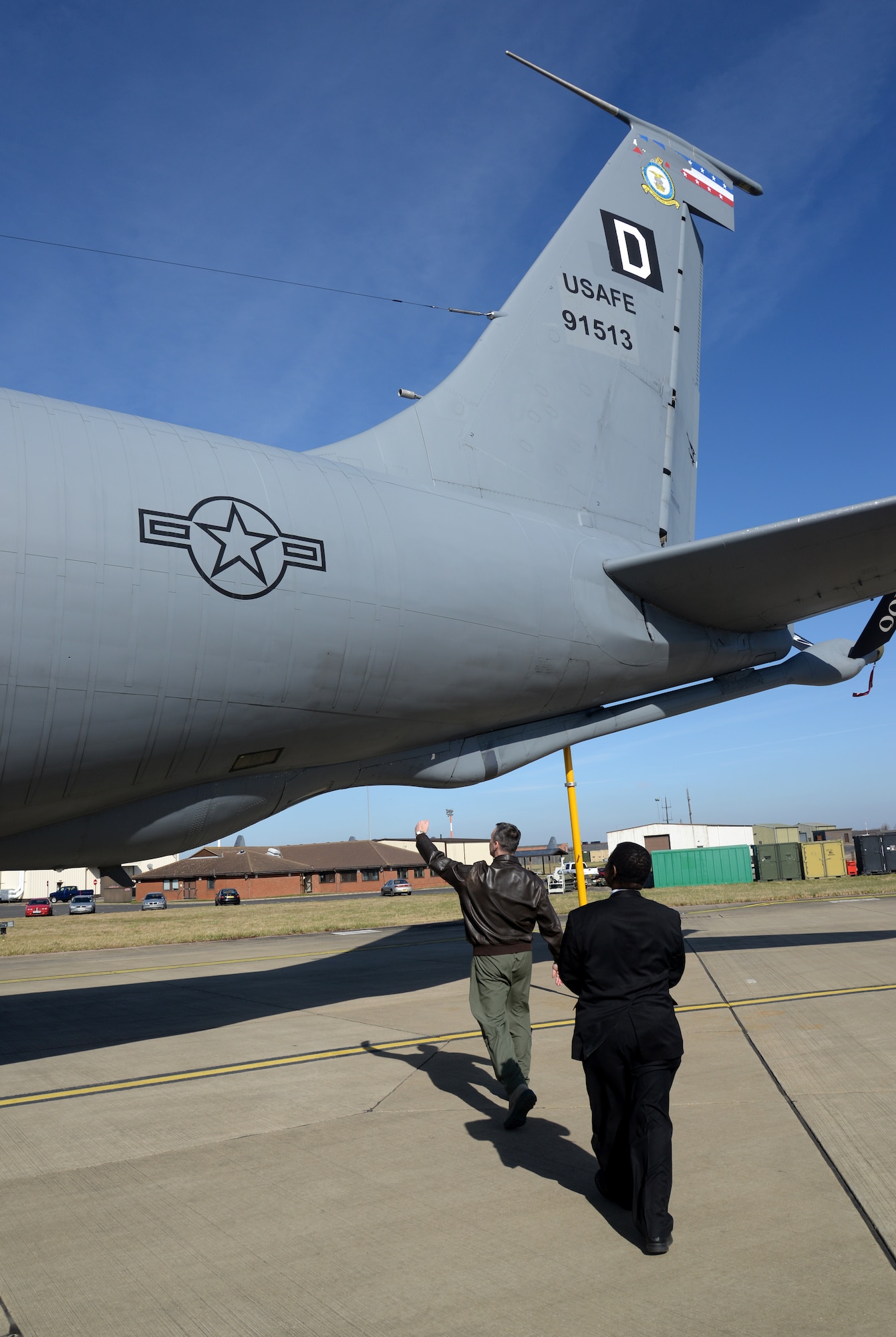 U.S. Air Force Lt. Col Joel Rivard, left, 351st Air Refueling Squadron operations officer from North Dighton, Mass., explains the outside of a KC-135 Stratotanker to Dr. Adedji B. Badiru, Air Force Institute of technology Dean of the Graduate School of Engineering and Management, March 11, 2015, during his visit to RAF Mildenhall, England. The dean visited to learn more about the base and what he could bring back to apply to the AFIT curriculum. (U.S. Air Force photo by Senior Airman Kate Maurer/Released) 