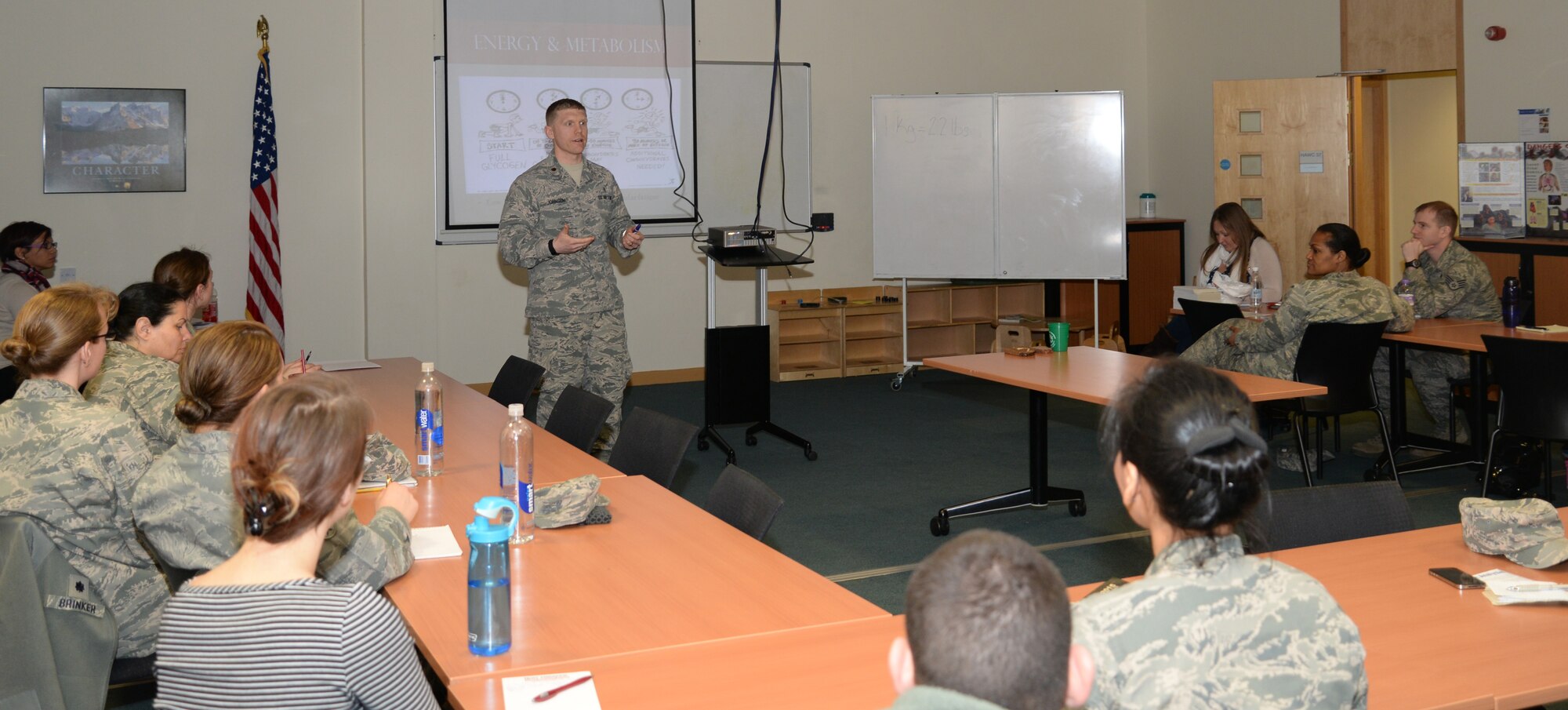 U.S. Air Force Maj. Jeremiah Johnson, 48th Aerospace Medicine Squadron Public Health flight commander, teaches a sports nutrition basics class March 11, 2015, at the fitness center on RAF Lakenheath, England. Johnson covered basic nutritional tips for people who participate in physical activity throughout their week. (U.S. Air Force photo by Airman 1st Class Jonathan Light/Released)