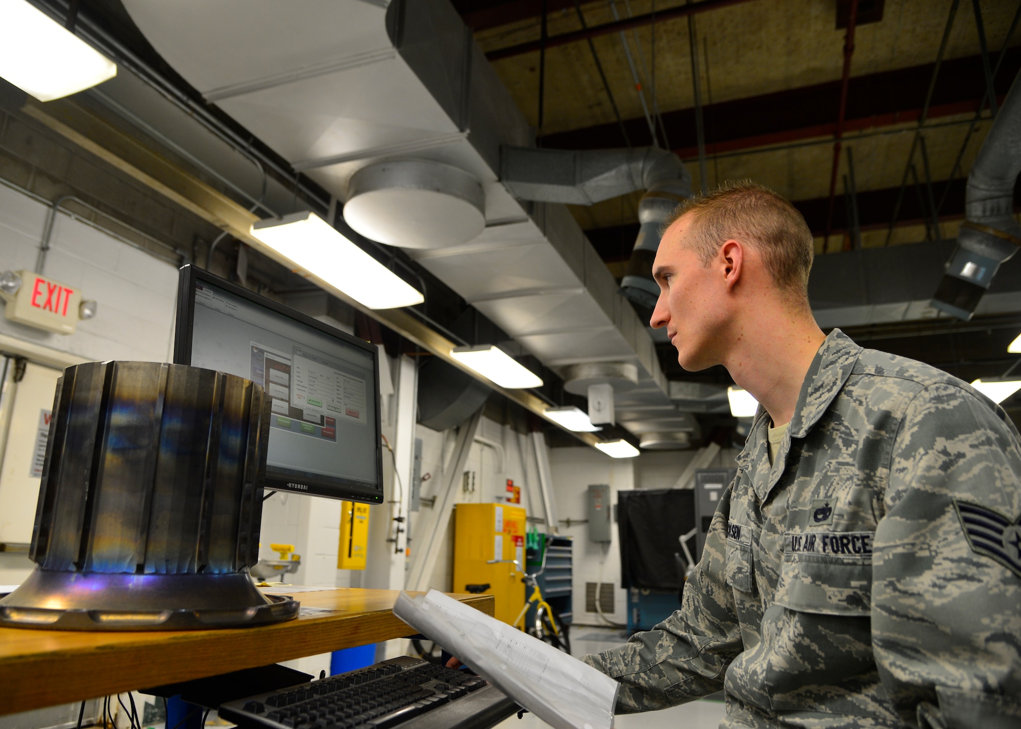 Staff Sgt. Chad Ericksen, 436th Maintenance Squadron Non-destructive Inspection craftsman, inputs data about a torque tube into the Parts, Inspection, Turnover (PIT) log March 12, 2015, at Dover Air Force Base, Del. Ericksen created the PIT program in 2012 to transition from log books to a more modern format with better report accuracy. (U.S. Air Force photo/Airman 1st Class William Johnson)