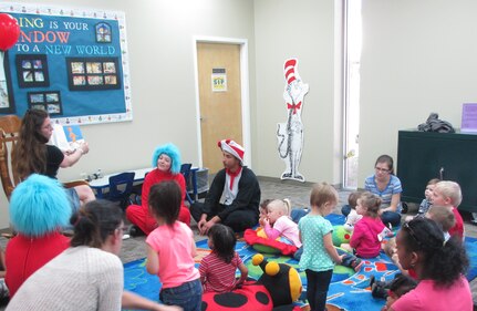 Joint Base Charleston families along with the Cat and in Hat, and Thing 1 and Thing 2 celebrated the birthday of famed children's author Dr. Seuss March 1, 2015 at the Joint Base Charleston Weapons Station Library, S.C.. The birthday event included story time, games, crafts and even birthday cupcakes.  (Courtesy Photo) 