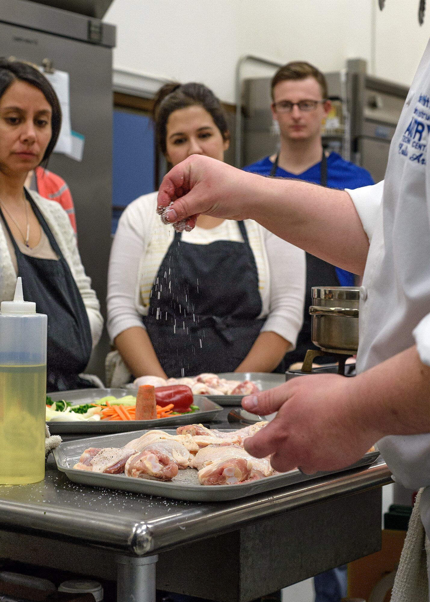 VANCE AIR FORCE BASE, Okla. -- Vance students receive professional culinary instruction at Autry Technology Center in Enid, March 2. Team Vance enjoyed the first night of a four-part culinary course coordinated by the base's Single Airman Programming Initiative. (U.S. Air Force photo / David Poe)