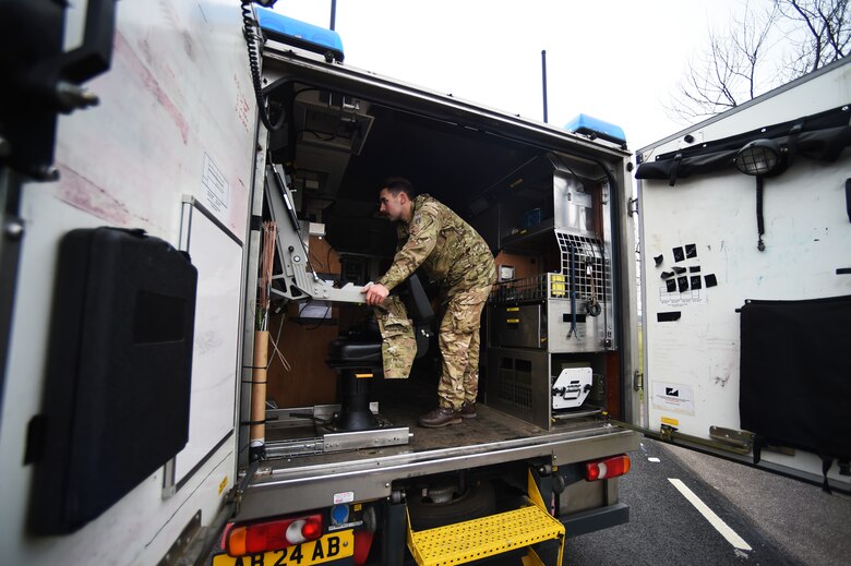 Royal Air Force Senior Aircraftsman Technician Zac Herdman, with the 5131 Bomb Disposal Squadron at RAF Wittering, recalls a bomb disposal robot following a training exercise at RAF Alconbury, England, March 17, 2015. In order to minimize the danger to individuals, a mobile command center remotely controlled the robot. (U.S. Air Force photo by Staff Sgt. Jarad A. Denton/Released) 