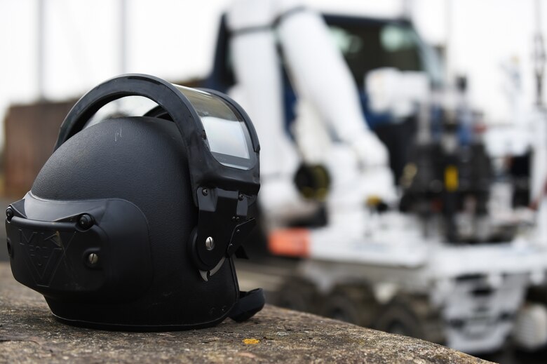 A Royal Air Force 5131 Bomb Disposal Squadron robot makes its way toward a suspicious vehicle, parked at the RAF Alconbury, England large vehicle inspection gate, during a training exercise, March 17, 2015. Controlled by an operator hundreds of feet away, the robot can safely assess and interact with hazardous materials and situations. (U.S. Air Force photo by Staff Sgt. Jarad A. Denton/Released)
