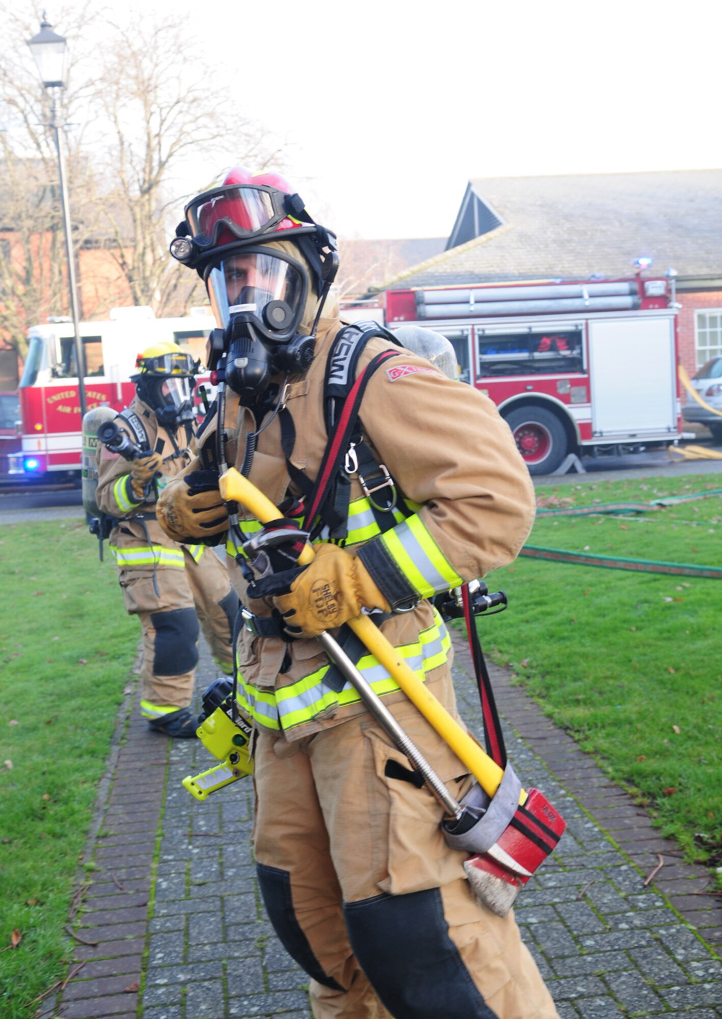 U.S. Air Force Tech. Sgt. David Ordway, 100th Civil Engineer Squadron fire protection station chief from Cabot, Ark., talks on the radio inside his gas mask to other firefighters Dec. 3, 2012, as they provide each other information on the current situation during an operational readiness exercise, at RAF Mildenhall, England. Ordway was recently named U.S. Air Forces in Europe and Air Forces Africa NCO of the Year. Ordway is one of the fire protection station chiefs at RAF Mildenhall. His responsibilities include oversight management and leadership of 36 firefighters including local nationals, Ministry of Defence and U.S. military personnel. (U.S. Air Force photo by Karen Abeyasekere/Released)