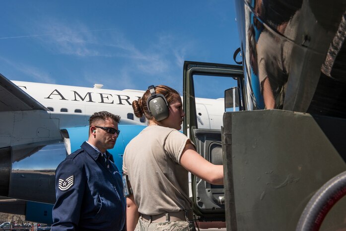 Airman 1st Class Desiree Mosher, 628th Logistics Readiness Squadron fuels distribution operator, refuels a 1st Airlift Squadron C-32A at Joint Base Charleston, S.C., during an off-station training mission March 12, 2015. Tech. Sgt. Brian Clipper, an 89th Maintenance Group flying crew chief, observes the operation and assists in the process. (U.S. Air Force photo by Senior Master Sgt. Kevin Wallace/RELEASED) 