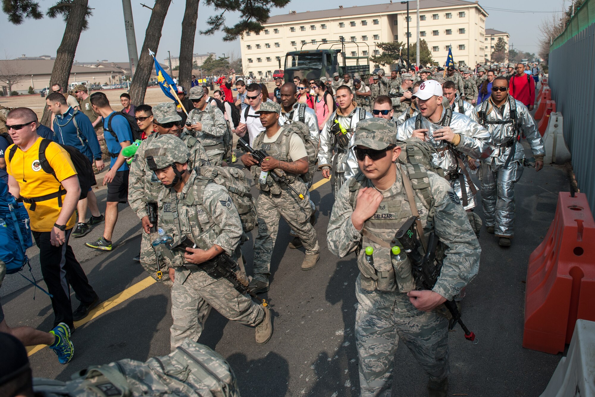 U.S. Air Force Airmen begin a six-mile ruck during a Wolf Pack Day event, Ruck for the Wounded, at Kunsan Air Base, Republic of Korea, March 16, 2015. The run and walk was held in remembrance of those who have made sacrifices for their country, while promoting individual and team resiliency. (U.S. Air Force photo by Senior Airman Taylor Curry/Released) 