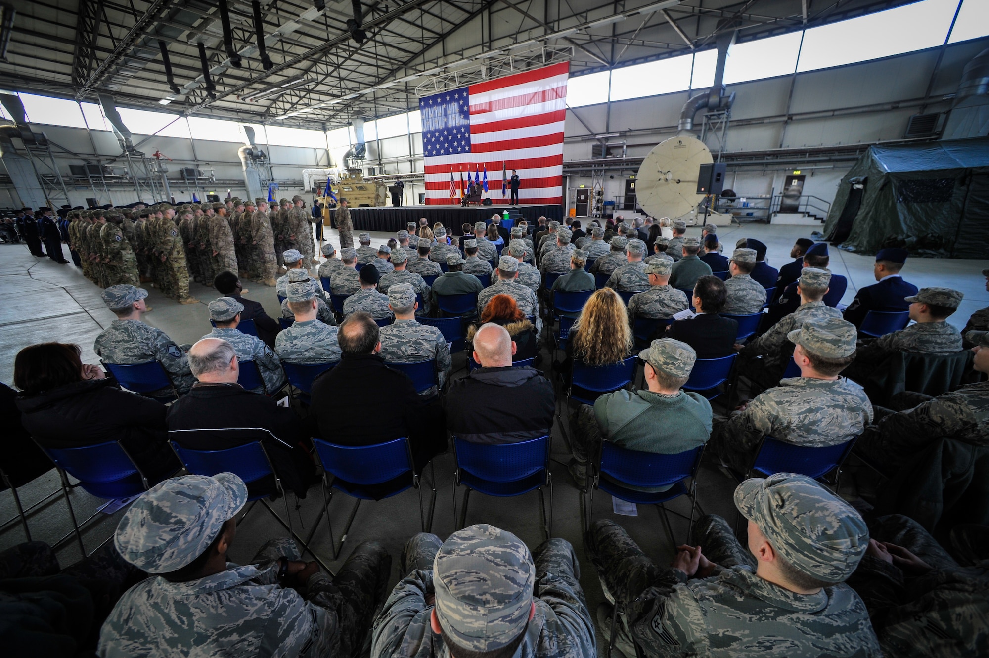 Airmen listen while presiding officer Lt. Gen. Darryl Roberson, 3rd Air Force and 17th Expeditionary Air Force commander, welcomes the 435th Air Ground Operations Wing and 435th Air Expeditionary Wing incoming commander March 16, 2015, at Ramstein Air Base, Germany.  Col. Andra Kniep assumed command of the two wings during the assumption of command ceremony. (U.S. Air Force photo/Senior Airman Nicole Sikorski) 