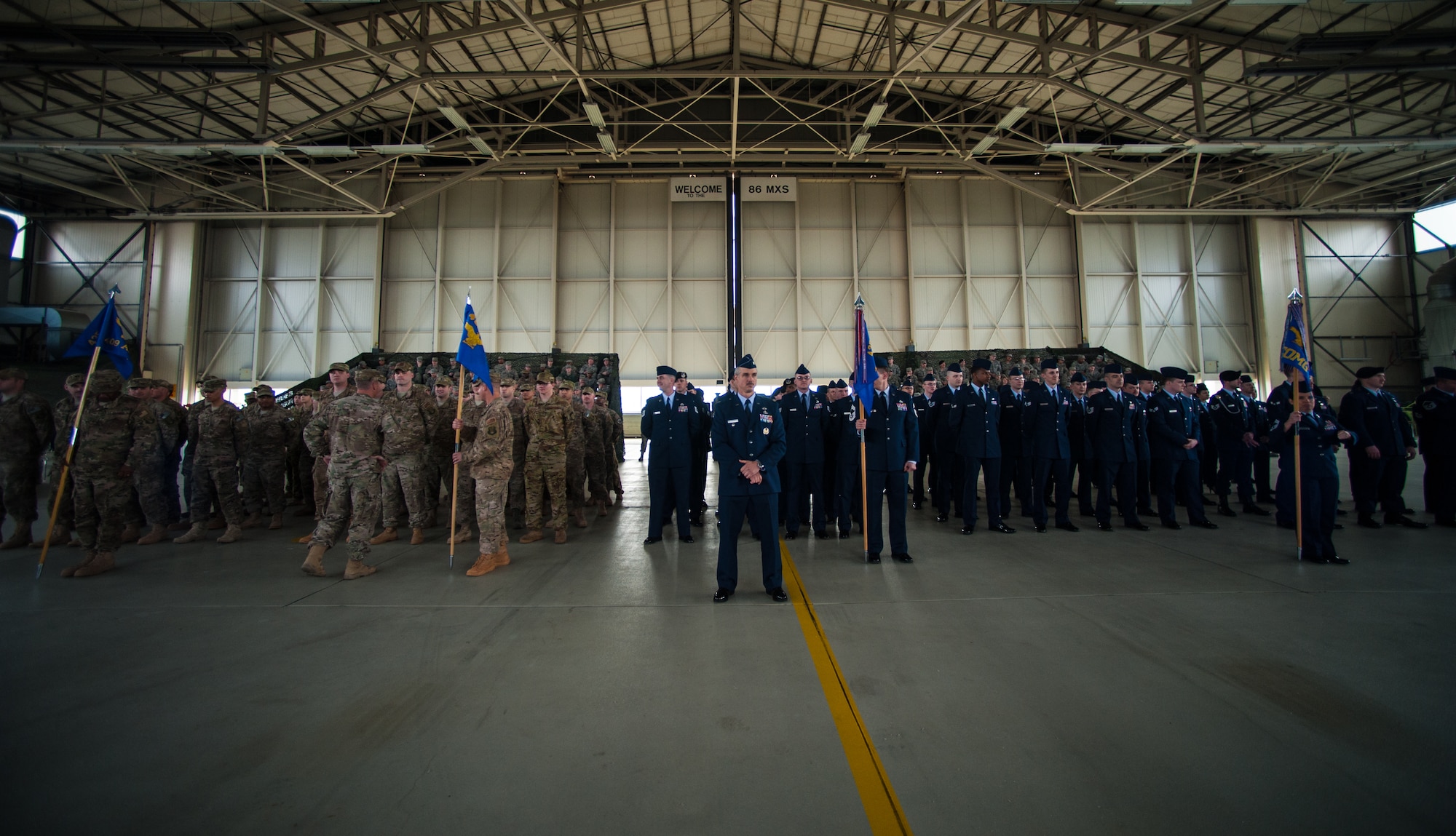 Airmen assigned to the 435th Air Ground Operations Wing and 435th Air Expeditionary Wing gather for an assumption of command ceremony, March 16, 2015, at Ramstein Air Base, Germany.  Col. Andra Kniep accepted the guidon of command from presiding officer, Lt. Gen. Darryl Roberson, 3rd Air Force and 17th Expeditionary Air Force commander.  (U.S. Air Force photo/Senior Airman Nicole Sikorski) 