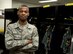 U.S. Air Force Airman 1st Class Nicholas Ferrari, 35th Operations Support Squadron aircrew flight equipment journeyman, poses in front of a group of lockers filled with pilot gear at Misawa Air Base, Japan, Mar. 18, 2015. Ferrari is responsible for maintaining flight equipment like helmets, oxygen masks, parachutes, flotation devices, survival kits and night vision goggles. (U.S. Air Force photo by Airman 1st Class Jordyn Rucker/Released)