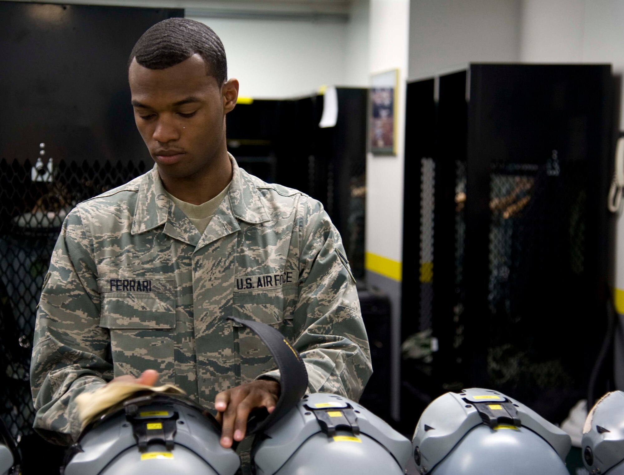 U.S. Air Force Airman 1st Class Nicholas Ferrari, 35th Operations Support Squadron aircrew flight equipment journeyman, conducts a pre-flight inspection of pilot gear at Misawa Air Base, Japan, Mar. 18, 2015. Ferrari performs operator maintenance and service inspections on flight equipment to ensure working order. During inspections he operates various types of equipment including oxygen, leakage, and radio testers. (U.S. Air Force photo by Airman 1st Class Jordyn Rucker/Released)