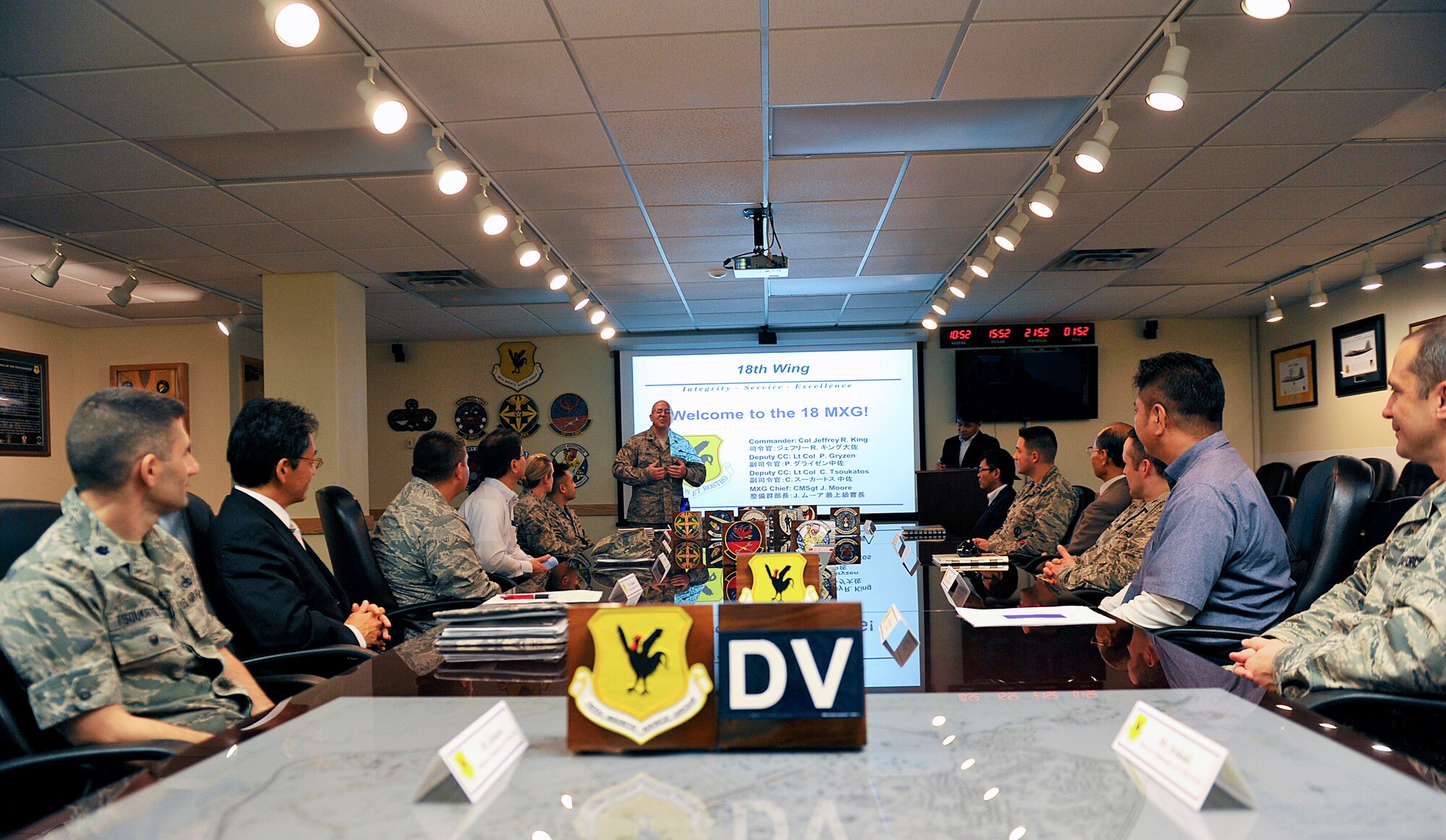 U.S. Air Force Col. Jeffrey King, 18th Maintenance Group commander, welcomes honorary commanders during a tour on Kadena Air Base, Japan, March 17, 2015. The honorary commanders were given the opportunity to observe Kadena's maintenance facilities systems and capabilities. (U.S. Air Force photo by Naoto Anazawa)