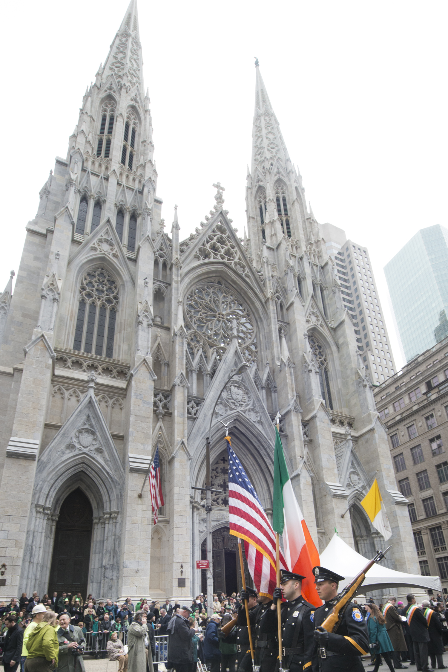 St. Patrick's Day parade participants march past St. Patrick's Cathedral in New York City, March