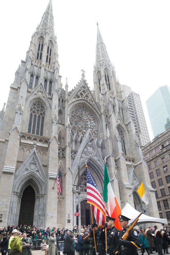 St. Patrick's Day parade participants march past St. Patrick's Cathedral in New York City, March 17, 2015.