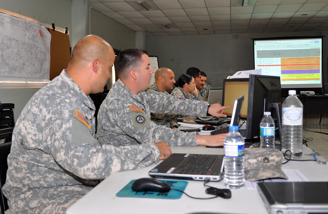 Members of the Nebraska, Puerto Rico and Vermont National Guards track incident reports during Operation Borinqueneer Response on Camp Santiago Joint Maneuver Training Center in Salinas, Puerto Rico, March 17, 2015. Operation Borinqueneer Response is a training exercise that enhances National Guard readiness during emergencies.