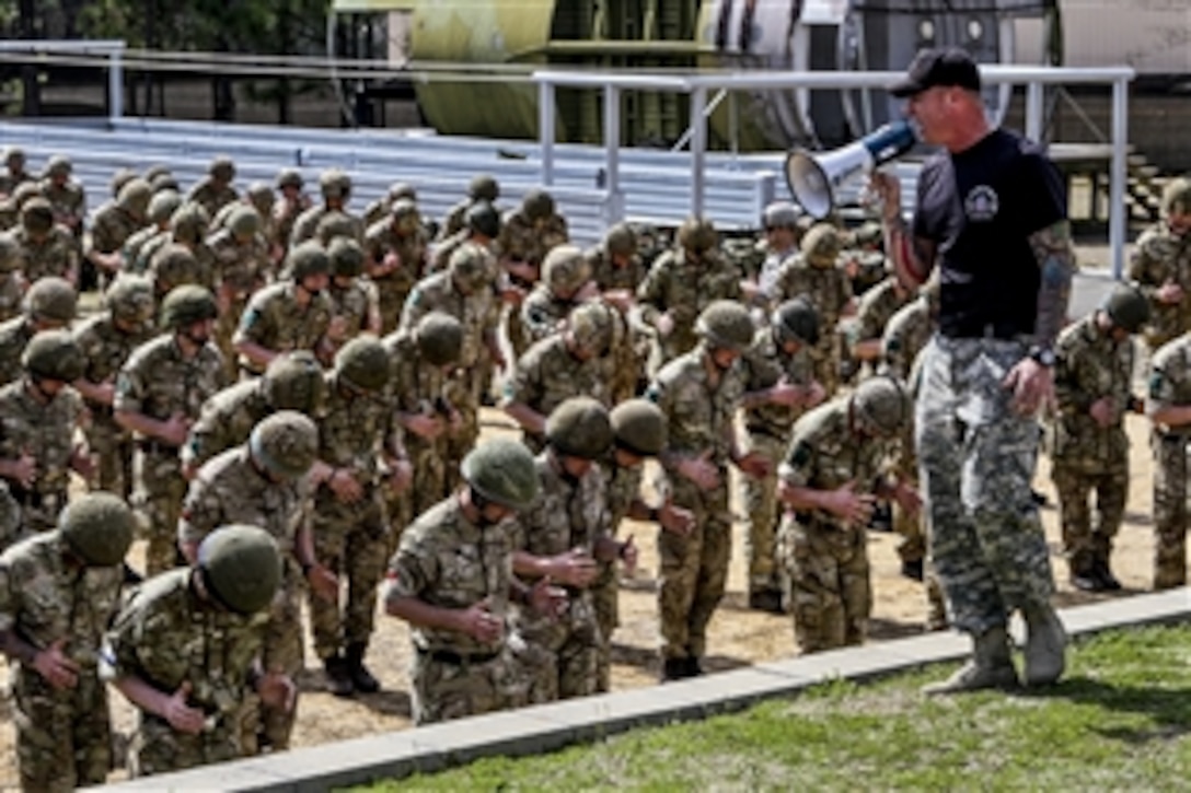 U.S. and British soldiers conduct airborne training at a school on Fort Bragg, N.C., March 16, 2015. The U.S. soldiers are paratroopers assigned to 82nd Airborne Division's 2nd Brigade Combat Team. 


