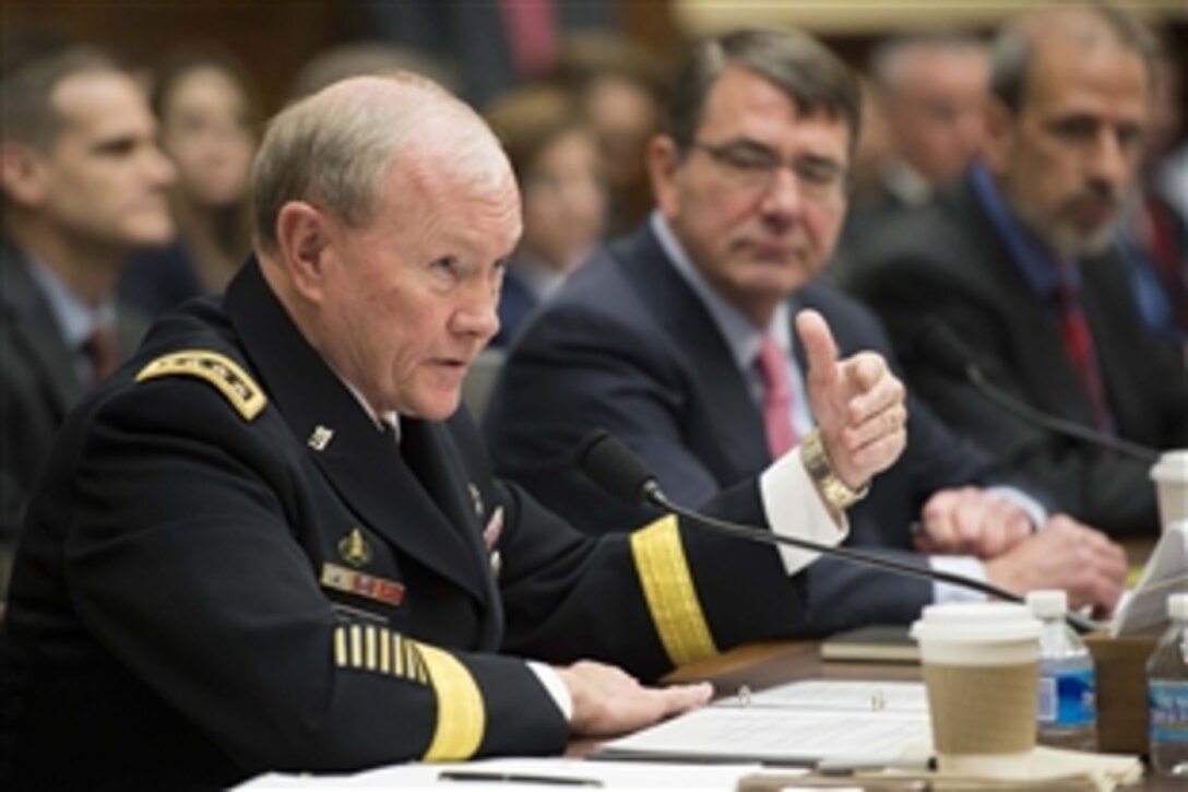 Army Gen. Martin E. Dempsey, chairman of the Joint Chiefs of Staff, testifies as Defense Secretary Ash Carter looks on before the House Armed Services Committee in Washington, D.C., March 18, 2015. The two defense leaders focused on defense programs and combating the Islamic State of Iraq and the Levant, or ISIL. 