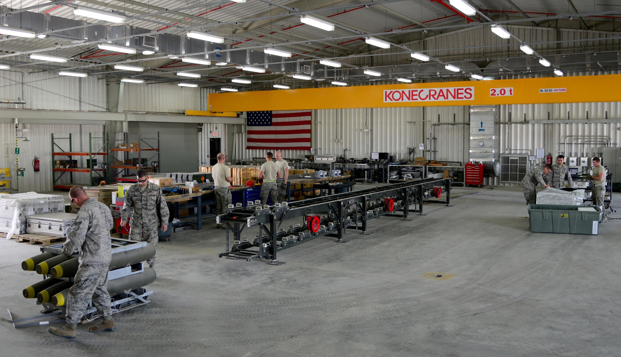 Ammo Airmen assigned to the 379th Expeditionary Maintenance Squadron prepare to build bombs, March 13, 2015, at Al Udeid Air Base, Qatar.  Day in and day out, Ammo Airmen work around the clock to build bombs that enable B-1 operators to deliver decisive air power to designated targets.  (U.S. Air Force photo by Senior Airman Kia Atkins)