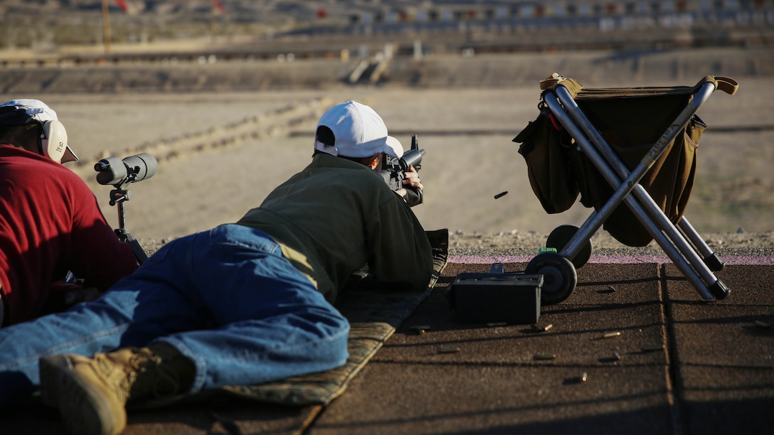 Adam Pereira, son of Ret. Gunnery Sgt. Jose Pereira, shoots an AR-15 300 yards from his target during the 7th Regiment Midrange Rifle Competition aboard the Combat Center, March 14, 2015. Two classifications of rifles were used for the event, high-powered rifles, which are rifles with a sling and no scope and F Class rifles, which have high-powered scopes and bi-pods. 