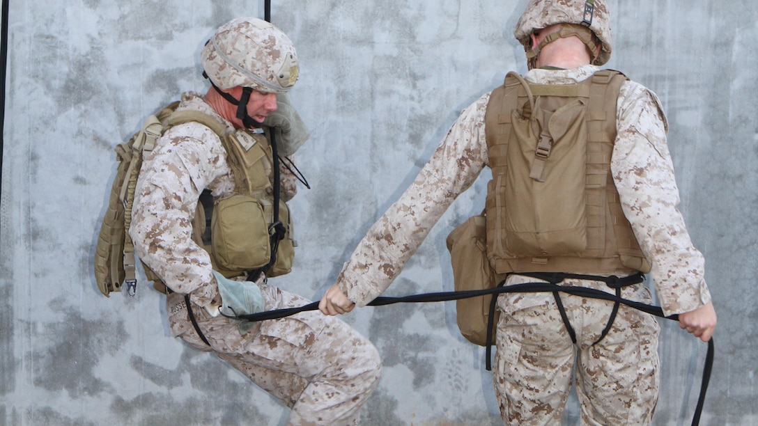 Lt. Col. Brian Russell, commanding officer, 1st ANGLICO, rappels down the side of the ANGLICO tower during Helicopter Rope Suspension Training. Marines with 1st and 6th ANGLICO conducted HRST during a three-week ANGLICO Basic Course, a three-section course implementing the basics of motor transportation, communications and call-for-fire techniques aboard Camp Pendleton, Calif., March 9, 2015.