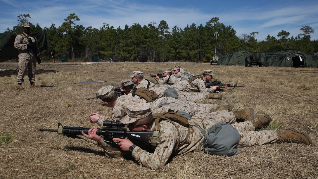 Gunnery Sgt. Ashton Benn, an assistant operations chief for II MEF Headquarters Group and Brooklyn, N.Y., native, teaches a class on combat formations during a MHG field exercise aboard Marine Corps Base Camp Lejeune, N.C., March 12-19, 2015. The purpose of the FEX was to allow the Marines the opportunity to test their skill sets and find areas of improvement.