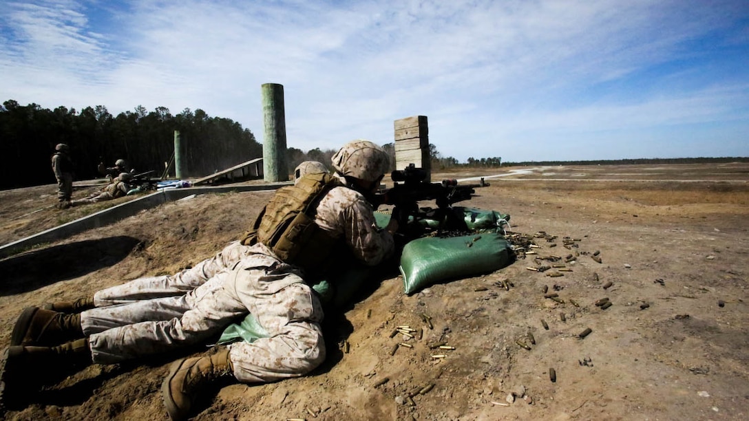 Marines with Bravo Company, 2nd Reconnaissance Battalion fire M240B machine guns during an aerial sniper and machine-gun familiarization exercise at training area SR-8 aboard Camp Lejeune, N.C., March 12, 2015. Marines with the unit used M240B machine guns and M110 semi-automatic sniper systems during the exercise. 