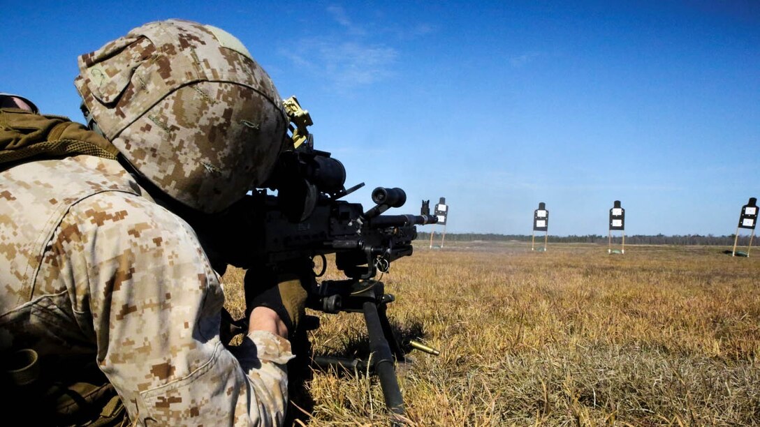 Lance Cpl. Keenan Scott, reconnaissance member with Bravo Company, 2nd Reconnaissance Battalion and a native of Toronto, Ohio, performs a battlesight zero on his M240B machine gun at training area SR-8 aboard Camp Lejeune, N.C., March 12, 2015. Marines with the unit used M240B machine guns and M110 semi-automatic sniper systems during the aerial sniper and machine-gun familiarization fire.
