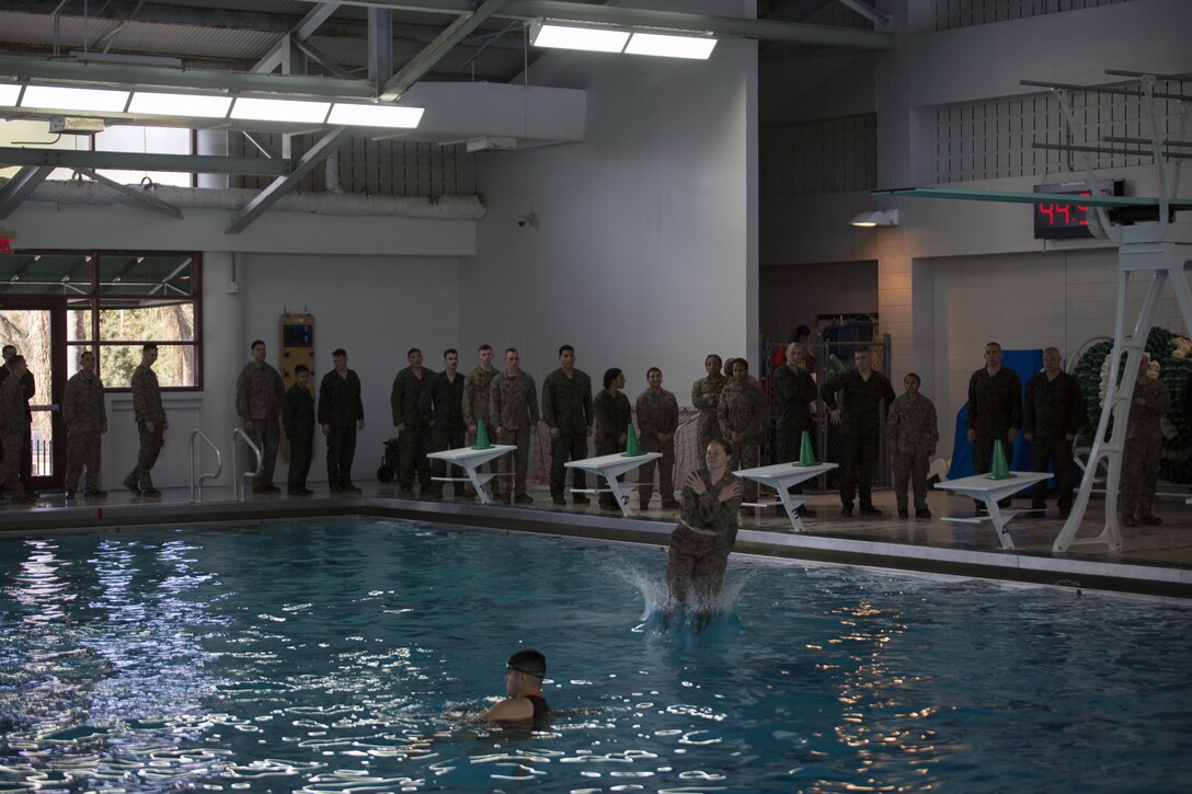 Marines with Marine Forces Reserve jump off the high dive at Tulane University, New Orleans, during corporal’s course, March 17, 2015. Marines from corporal’s course completed swim qualifications together to ensure mission readiness and meet annual training requirements. 