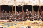 Soldiers of the Georgia Army National Guard's 560th Battlefield Surveillance Brigade listen to the Jordanian Armed Forces 12th “Al- Yarmuk” Brigade as they prepare for training exercise 'Eager Light' 15 on March 8, 2015 in Zarqa, Jordan.
 