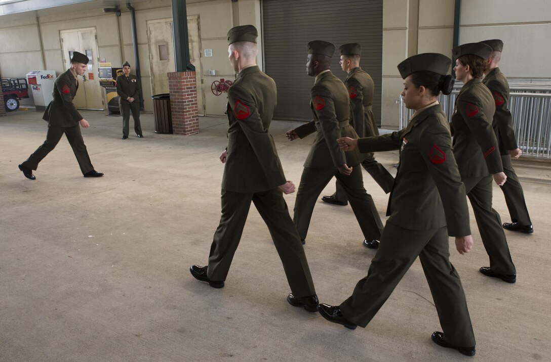 Marines with Marine Forces Reserve practice drill movements during corporal’s course at Marine Corps Support Facility New Orleans, March 16, 2015. The course incorporates land navigation, sword and guidon manual, and war fighting, but its main focus is on developing leadership skills for noncommissioned officers. 