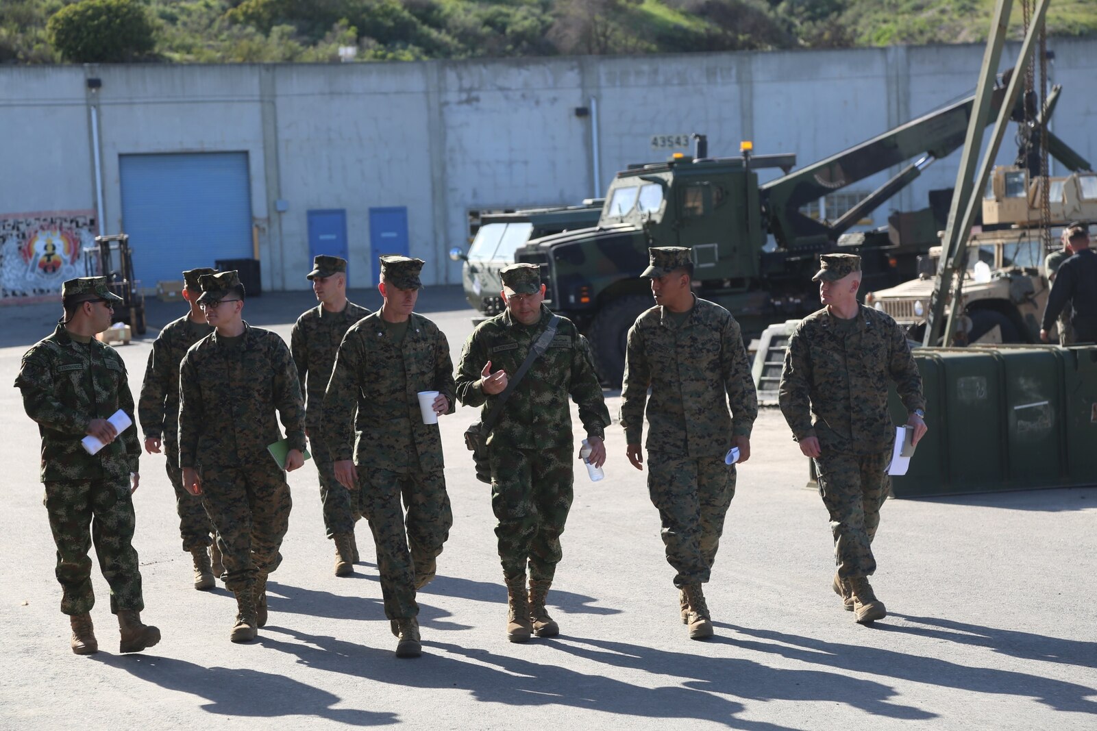 Lieutenant Col. Andres Perdomo, center, the Chief of Logistics for the Colombian Marine Corps, expresses his gratitude during a three-day tour at Combat Logistics Regiment 15, 1st Marine Logistics Group, aboard Camp Pendleton, California, March 3, 2015. Perdomo and Lt. Col. Ferdando Fernandez, a Battalion Commander for the Support Command, 6th Infantry Brigade, Colombian Marine Corps, visited 1st MLG to allow members of both the U.S. Marine Corps and Colombian Armed Forces to build an understanding of services, share best practices and strengthen camaraderie and interoperability. (U.S. Marine Corps photo by Sgt. Cody Haas/Released)