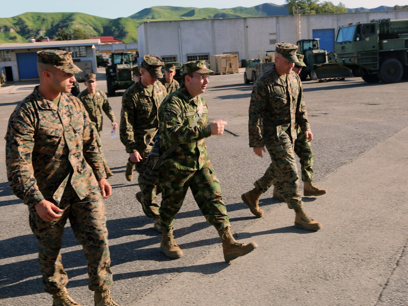 Lieutenant Col. Andres Perdomo, center, the Chief of Logistics for the Colombian Marine Corps, expresses his gratitude during a three-day tour around Combat Logistics Regiment 15, 1st Marine Logistics Group, aboard Camp Pendleton, California, March 3, 2015. Perdomo and Lt. Col. Ferdando Fernandez, a Battalion Commander for the Support Command, 6th Infantry Brigade, Colombian Marine Corps, visited 1st MLG to allow members of both the U.S. Marine Corps and Colombian Armed Forces to build an understanding of services, share best practices and strengthen camaraderie and interoperability. (U.S. Marine Corps photo by Sgt. Cody Haas/Released)