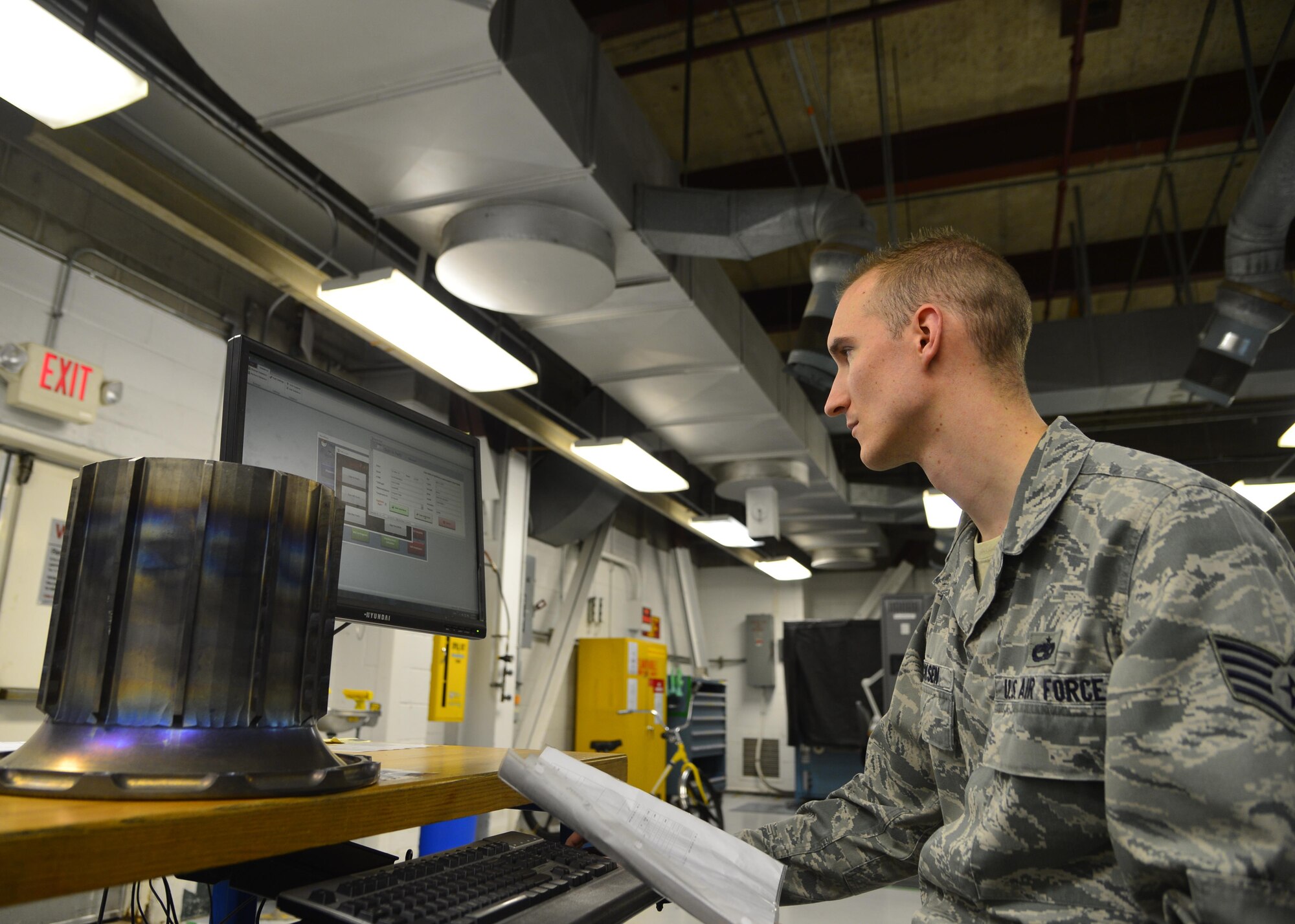 Staff Sgt. Chad Ericksen inputs data about a torque tube into the Parts, Inspection, Turnover (PIT) log March 12, 2015, at Dover Air Force Base, Del. Ericksen created the PIT program in 2012 to transition from log books to a more modern format with better report accuracy. Ericksen is a non-destructive inspection craftsman assigned to the 436th Maintenance Squadron. (U.S. Air Force photo/Airman 1st Class William Johnson)