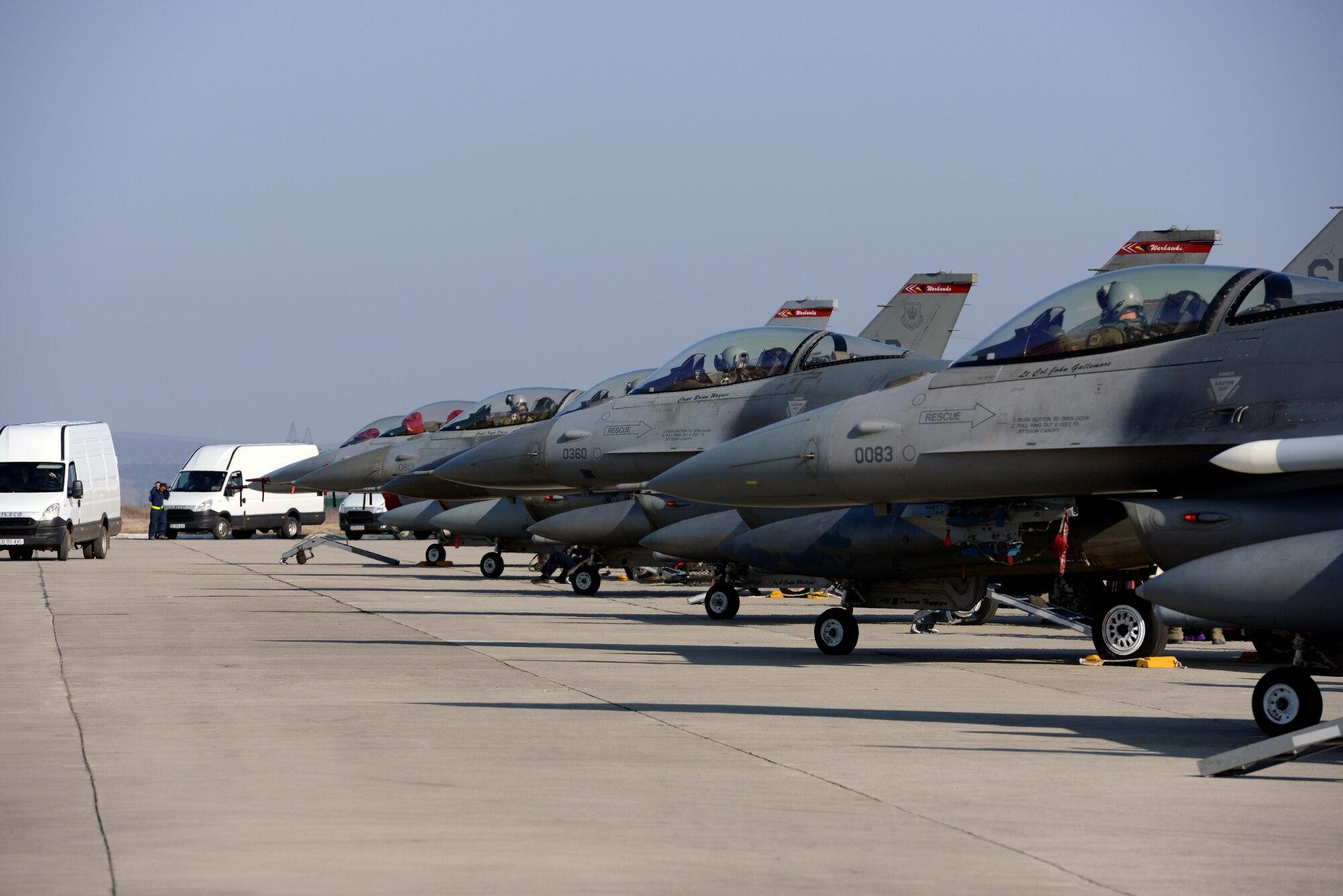 F-16CJ Fighting Falcons are lined up on the flightline for the first sortie of Dacian Warhawk, March 16, 2015, at Campia Turzii, Romania. Dacian Warhawk is a two-week long training mission designed to increase the interoperability between the U.S. and Romania. The training mission incorporated both ground and Air operations. The F-16s are assigned to the 480th Fighter Squadron. (U.S. Air Force photo/Staff Sgt. Kris Levasseur)