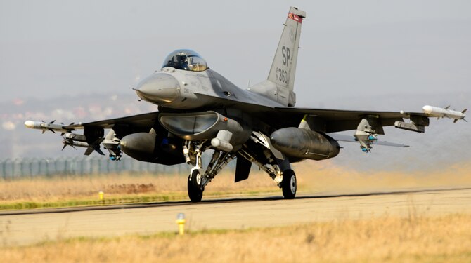 An F-16 Fighting Falcon pilot takes-off March 16, 2015, during the first sortie of Dacian Warhawk at Campia Turzii, Romania. The training missions are designed to incorporate both air and ground operations between the two nations, and include several partnership building events. The pilot is assigned to the 480th Fighter Squadron.  (U.S. Air Force photo/Staff Sgt. Armando A. Schwier-Morales)
