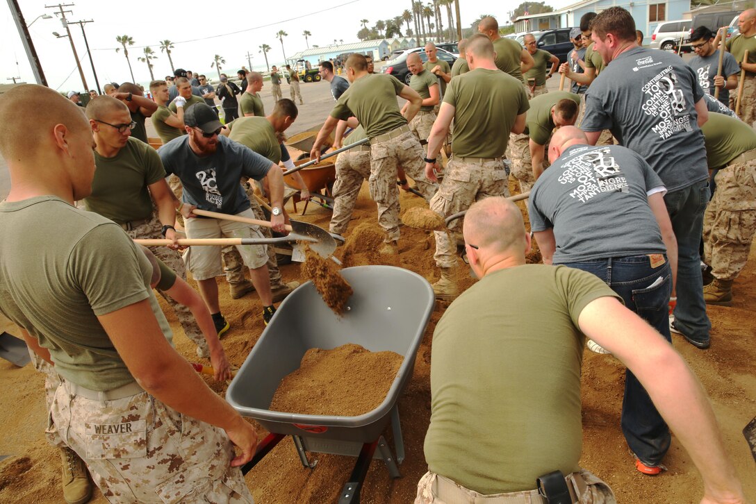 California Pizza Kitchen sent more than 700 Volunteers to assist School of Infantry – West Marines and Sailors to clean and renovate areas of San Onofre Beach, March 18. The groups broke up into three teams with one group painting and renovating the beach club, another handling landscaping and the third group painting the theatre and building playground equipment.