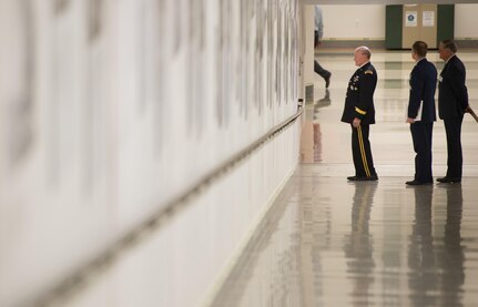 The 18th Chairman of the Joint Chiefs of Staff Army Gen. Martin E. Dempsey views the newly unveiled photo exhibit “National Memories” at the Pentagon, March 18, 2015. The exhibit sheds new light on the U.S. China relationship, showing American and Chinese service members working together during World War II.